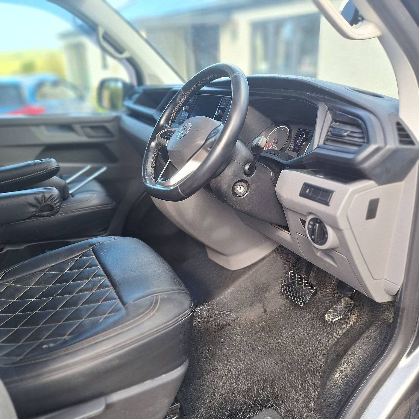 Same van interior after a full Shiney clean — fresh carpet, polished console, spotless trim
